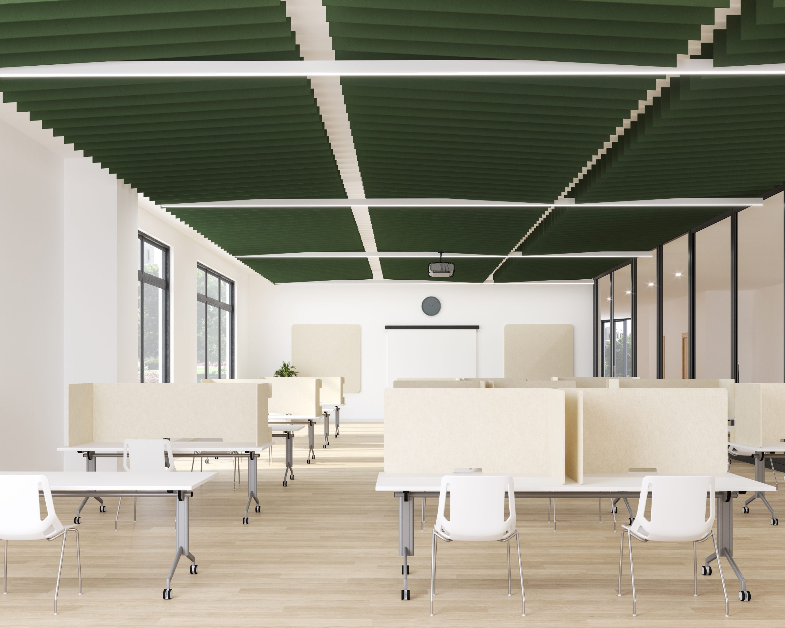A spacious classroom with large windows, white walls, and green winged acoustic baffles, which enhance sound quality, suspended from the ceiling. There are rows of rectangular tables with white chairs, separated by beige dividers. At the front, there's a whiteboard and a clock above it. Natural light fills the room.