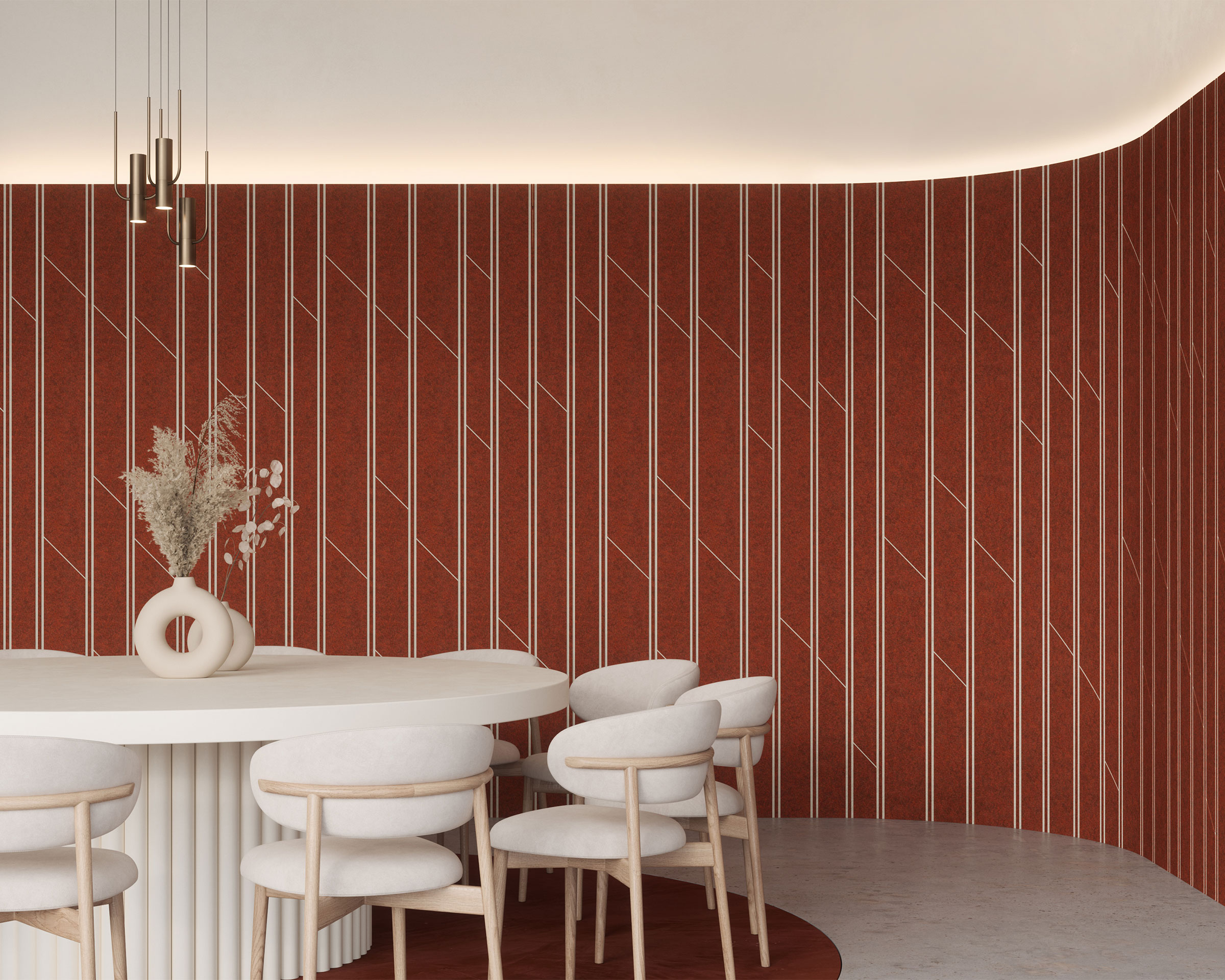 A modern dining area featuring a round white table with a unique textured base, surrounded by eight white chairs. The walls are adorned with bold red acoustic felt wall panels with white vertical and diagonal lines cut into the felt, for added soundproofing. A vase with dried flowers sits at the center of the table.