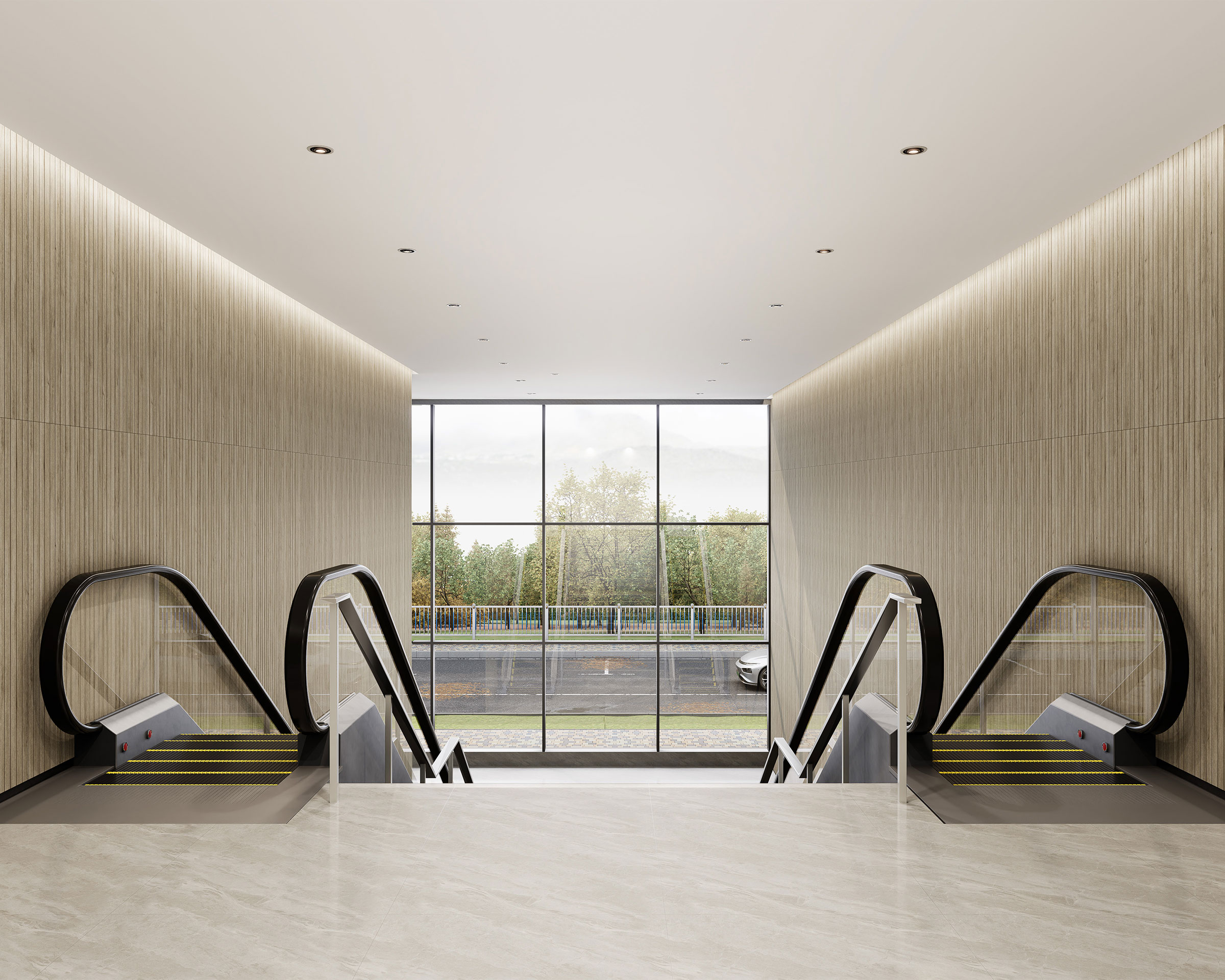 A modern interior features a pair of escalators descending side by side with sleek, stainless steel handrails. The wall finishes are light wood with woodgrain acoustic felt slats, and a large window at the end of the space reveals a view of trees and a road outside. Recessed lighting accents the ceiling.