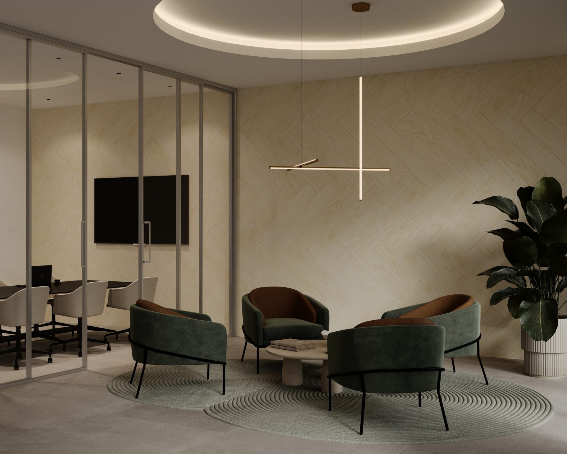 A modern office lounge featuring four green armchairs arranged around a circular rug, with a small coffee table in the center. Stylish pendant lighting hangs overhead. Acoustic felt wall planks add texture to the walls. In the background, there's a glass-walled conference room with chairs around a table and a large TV.