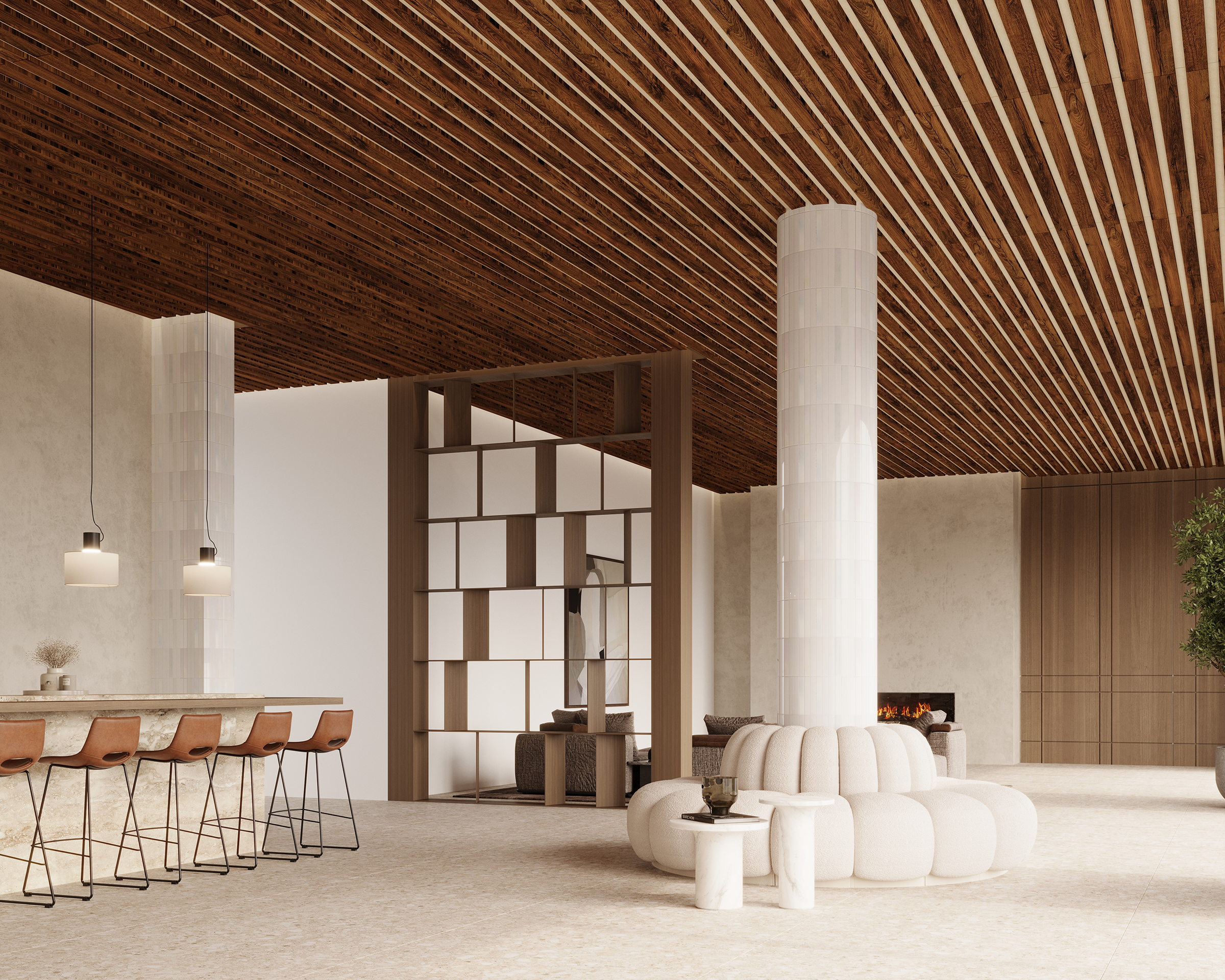 A spacious, modern living area featuring an acoustic felt slatted ceiling, white cushioned seating, and a central column. A partition with geometric cutouts divides the space. Bar stools line a counter on the left, and a cozy built-in fireplace is seen in the background.