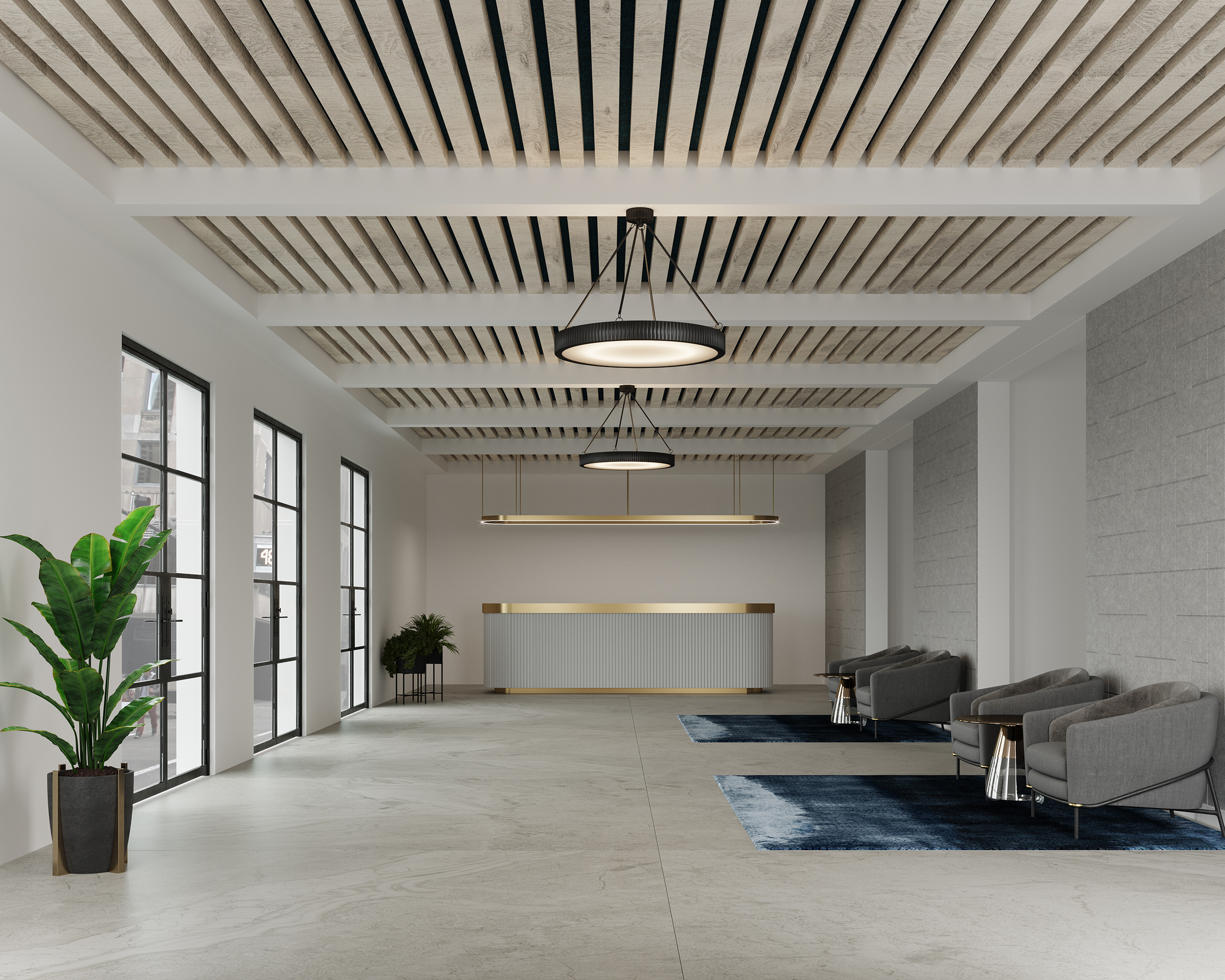 A modern, spacious lobby with high ceilings featuring an acoustic felt ceiling frame. Large windows line the left wall, allowing natural light to flood the space. The room is adorned with potted plants, gray armchairs, and blue rugs, with black pendant lights overhead.
