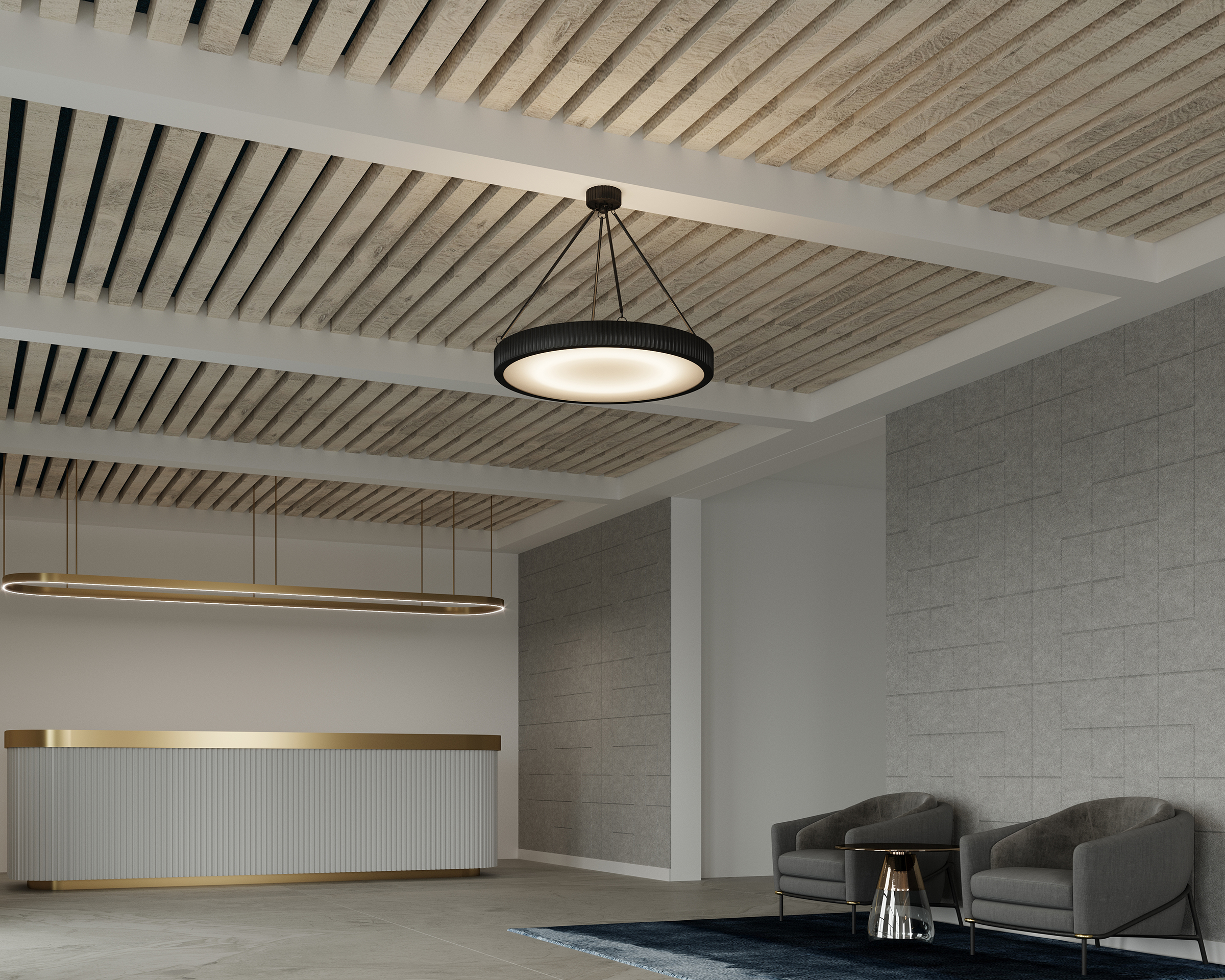 A modern reception area with an acoustic felt ceiling frame, a hanging circular light fixture, a reception desk with a gold accent, and two gray armchairs next to a small round table on a dark rug, against a wall with light gray paneling.