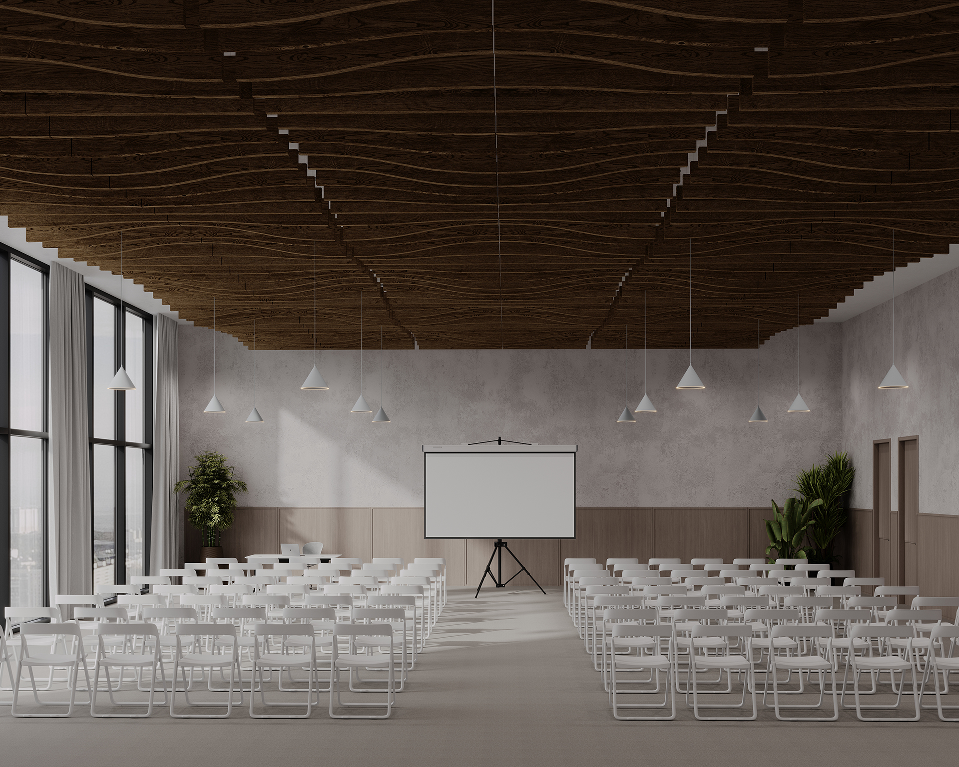 A modern conference room with white chairs arranged in rows facing a large projection screen on a tripod stand. The ceiling features decorative woodgrain acoustic felt panels, and there are pendant lights hanging from it. Large windows on the left side let in natural light. There are plants in the corners.