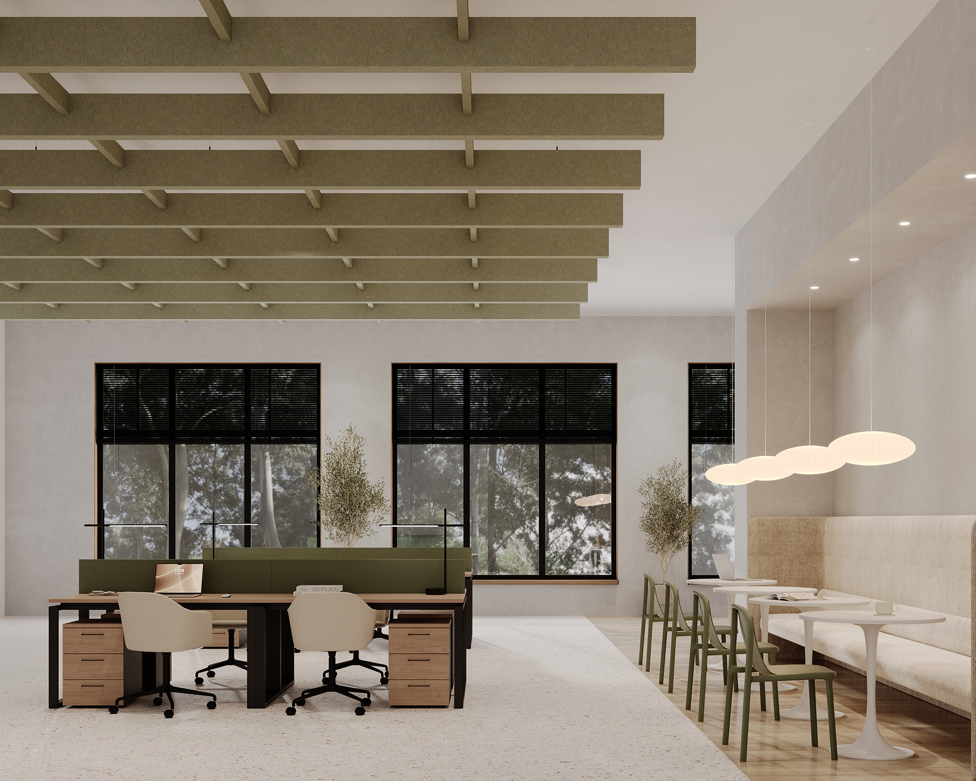 A modern, well-lit office space featuring a long desk with chairs and computers facing each other, flanked by green dividers. To the right, a cozy seating area with high-backed benches and small tables is illuminated by hanging spherical lights. Large windows bring in natural light and an acoustic felt beamed ceiling provides elegance and sound dampening.