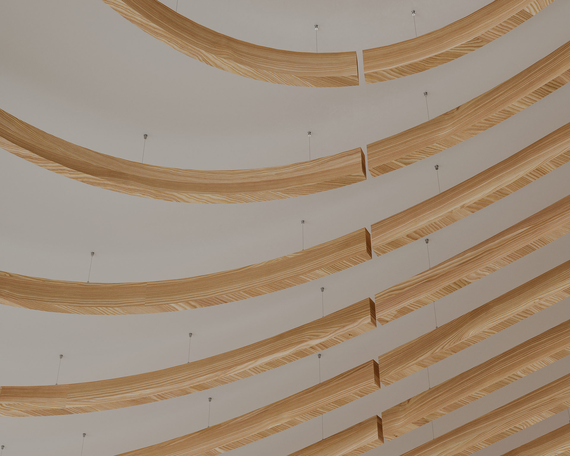 Curved woodprint acoustic felt baffles suspended from a white ceiling in a repeating pattern, creating a modern architectural design.