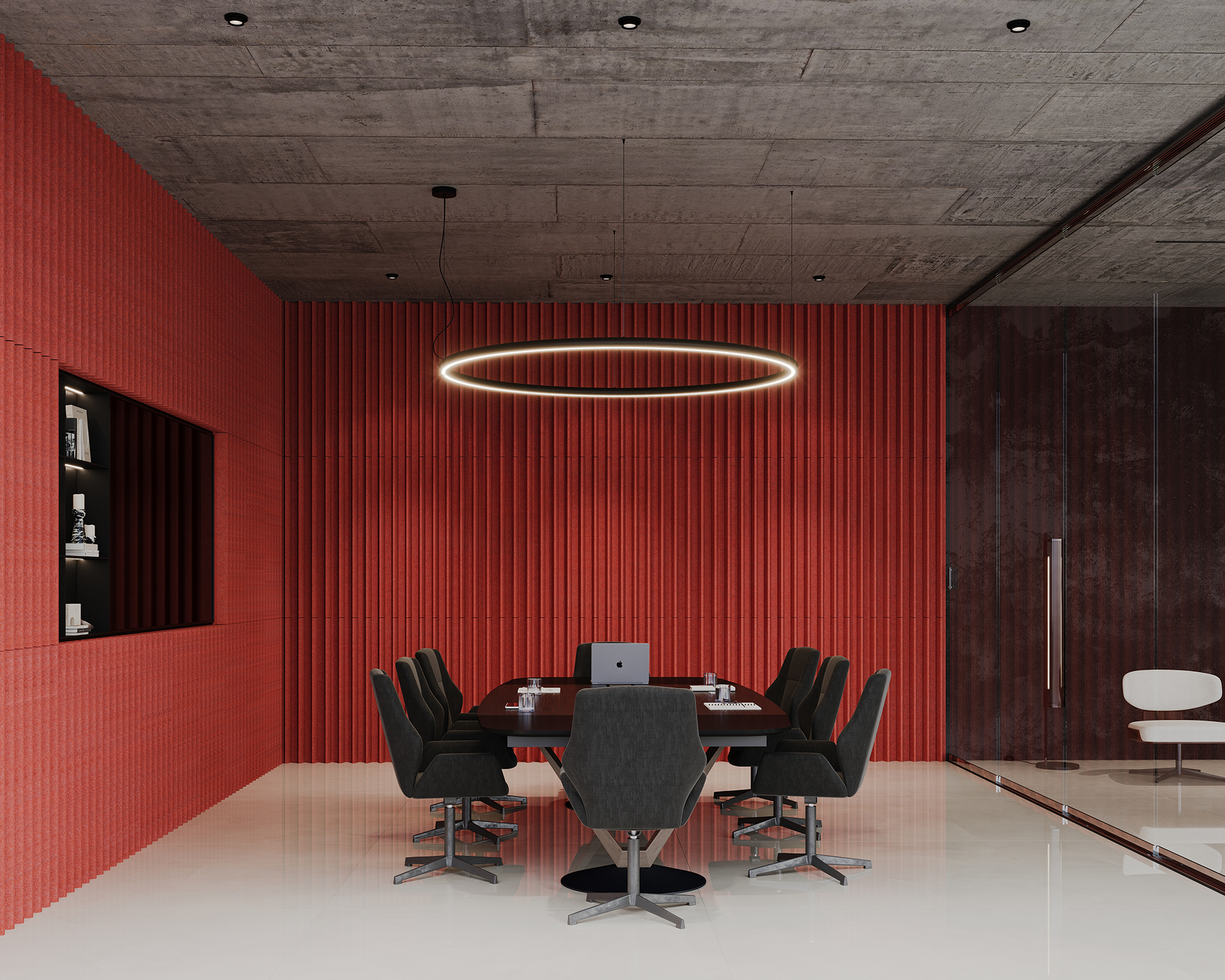 Modern conference room with a long table and eight black chairs. A laptop is on the table. The red-textured acoustic felt wall panels contrast with the gray ceiling. A circular pendant light hangs above. Glass partition on the right with a glimpse of another white chair.