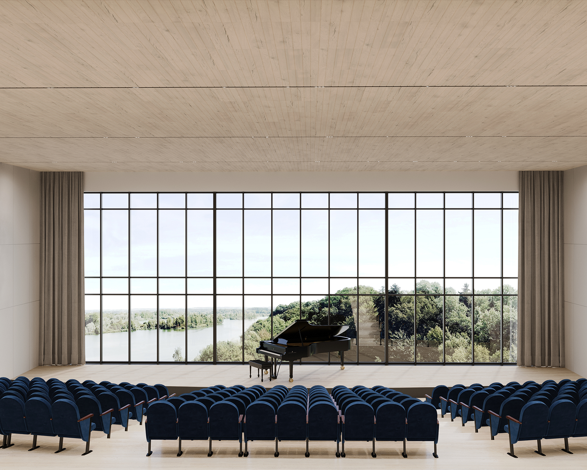 An empty concert hall with rows of blue seats faces a stage with a grand piano. A large glass window behind the stage reveals a scenic view of trees and a river under a clear sky, while the acoustic felt ceiling panels enhance the perfect sound quality throughout the space.