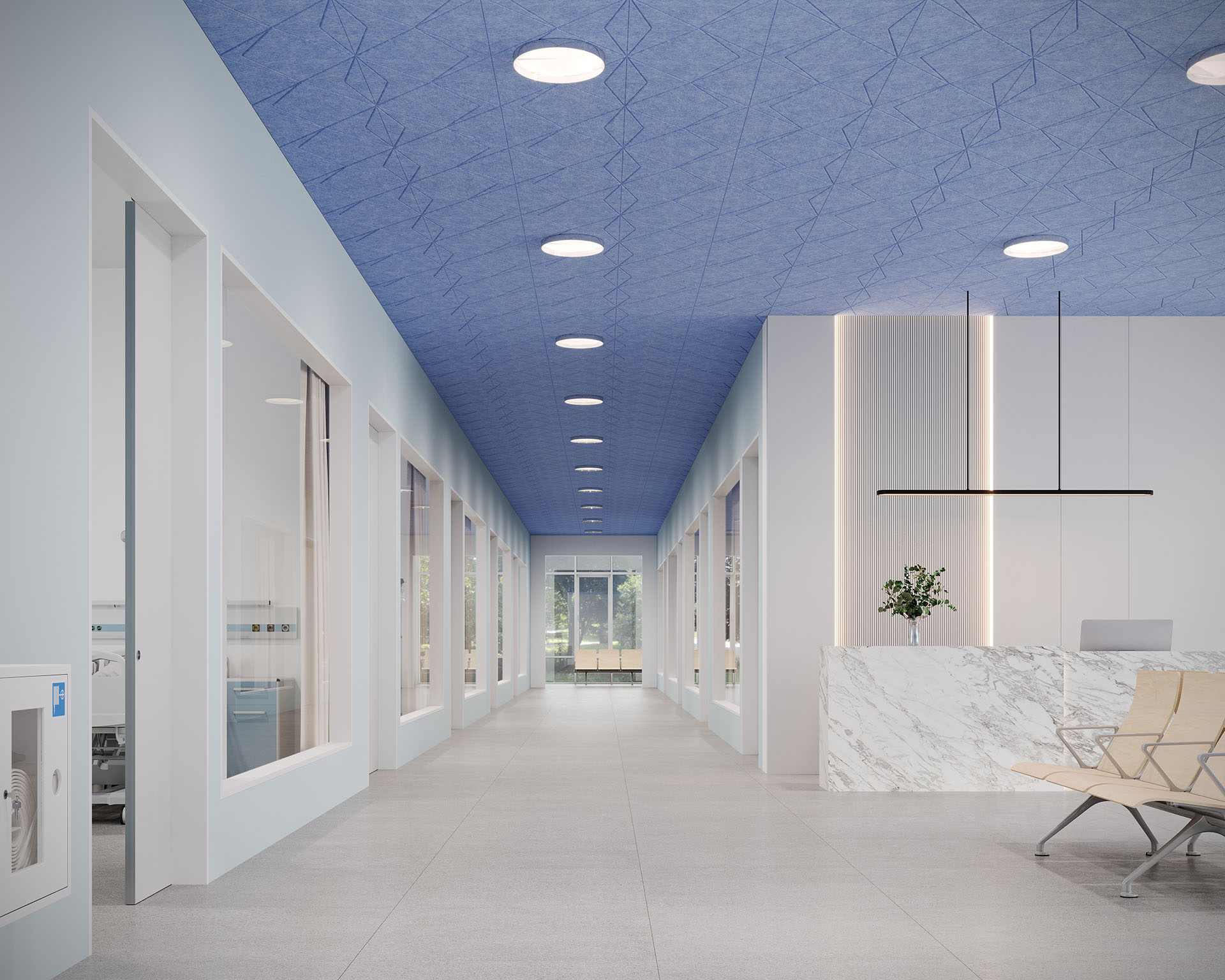 A modern interior hallway features a marble reception desk and blue textured ceiling with acoustic felt panels. Bright recessed lighting illuminates the corridor, leading to a glass exit. Large windows and a potted plant near the desk add natural charm to the space.