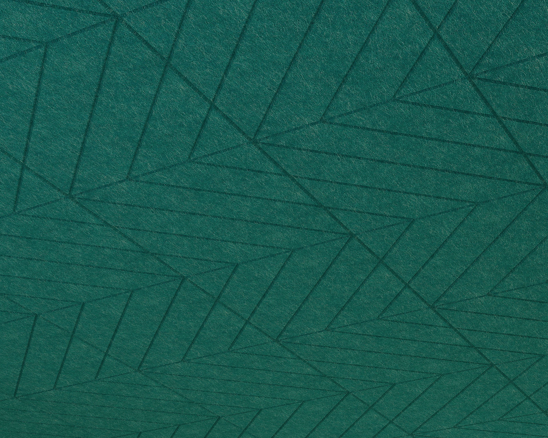 A textured green acoustic felt panel with an abstract geometric pattern of intersecting lines resembles fractured rays forming triangles and other shapes. The design creates a sense of depth and movement.