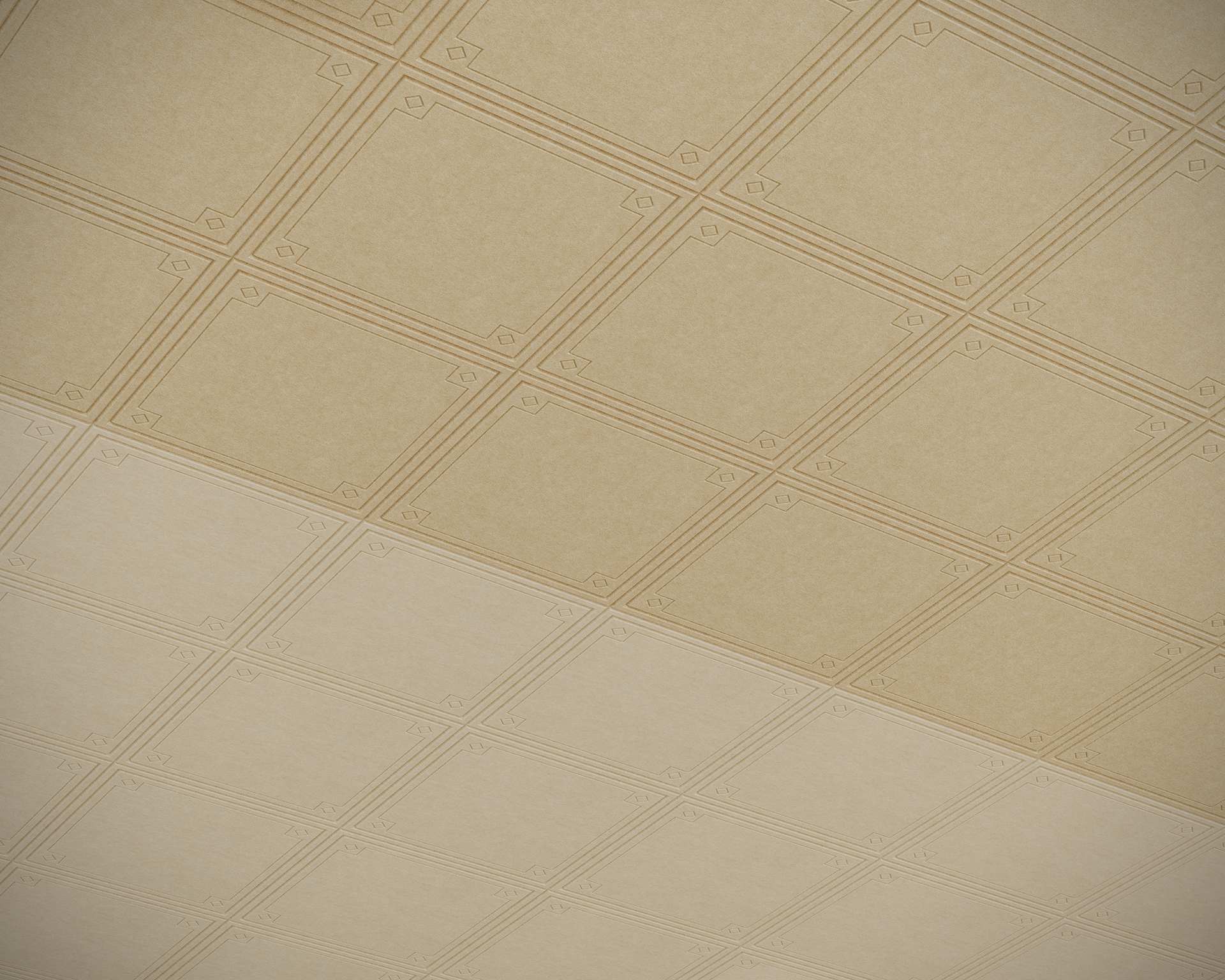 A ceiling with a grid of square, beige tiles featuring a subtle geometric acoustic felt pattern includes panels that resemble stamped design. The design showcases small, symmetrical motifs at the corners, and the lighting highlights the texture and depth of each tile.