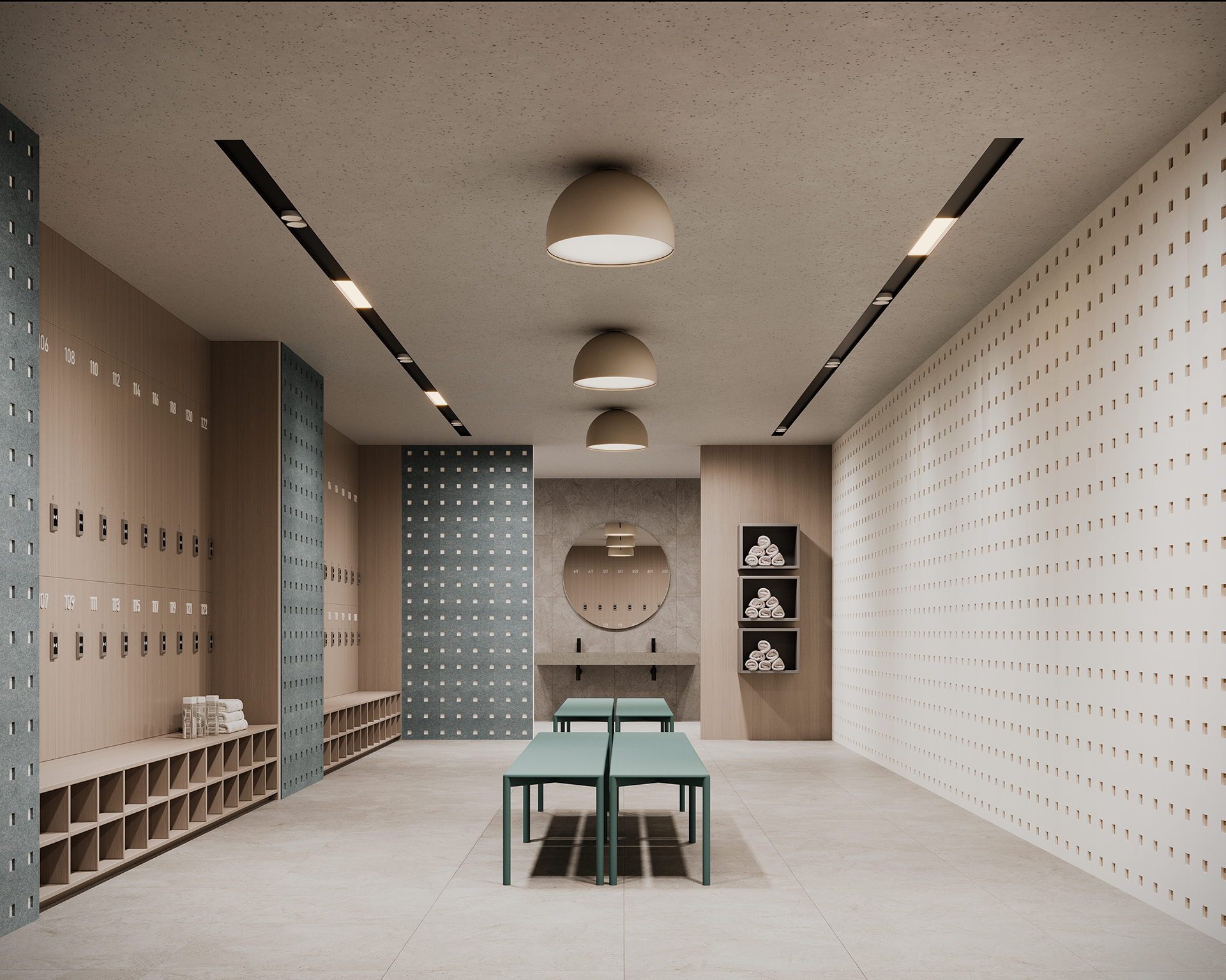 Modern locker room with wooden lockers, cubbies, and a large round mirror above a sink. Teal benches line the center. The acoustic felt walls have a perforated square design, and ceiling lights are evenly spaced above. Towels are neatly stacked in an open cubby.