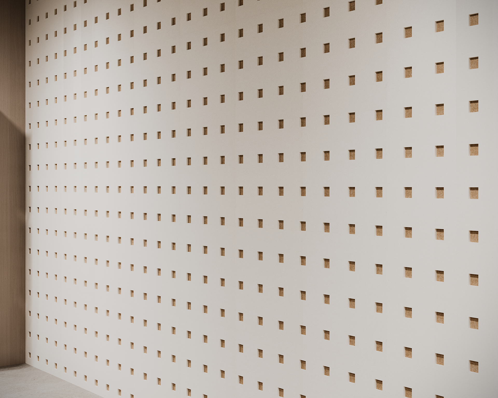 Wall with a grid of evenly spaced small square acoustic felt cutouts, creating a patterned surface. The wall is light-colored, and the cutouts reveal a slightly darker interior. The overall appearance is minimalist and geometric.