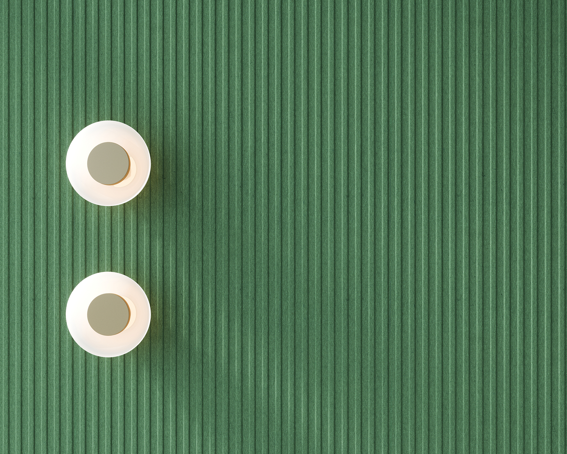Two white lights with greenish-gray bases are placed on a ribbed green acoustic felt wall, positioned in the upper left corner of the image. The rest of the wall is unoccupied, creating a minimalist and balanced composition.