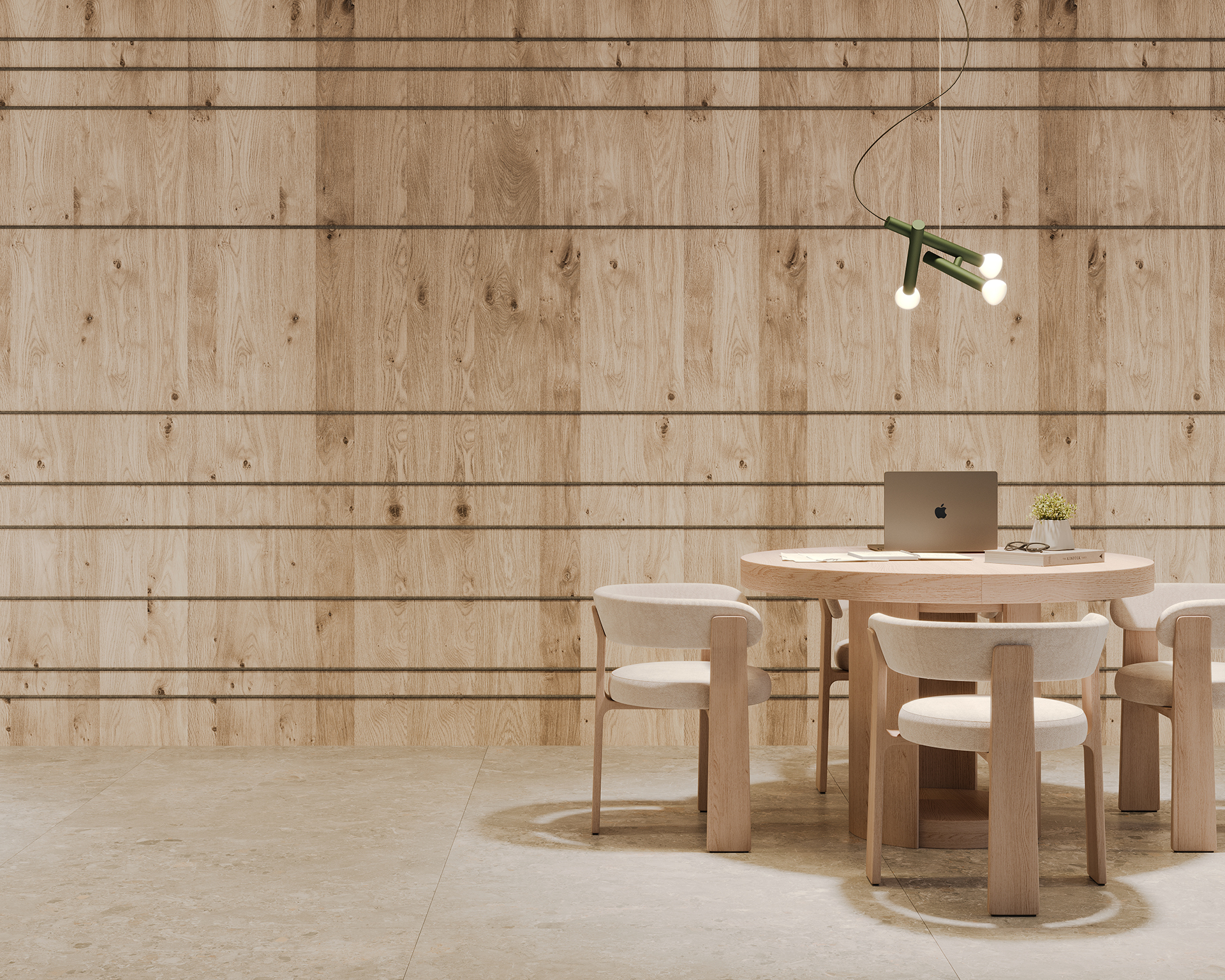 A modern dining area with a round wooden table, beige chairs, and a green pendant light. A laptop and a small potted plant are on the table. The background features a light woodgran acoustic felt panel wall with horizontal lines.