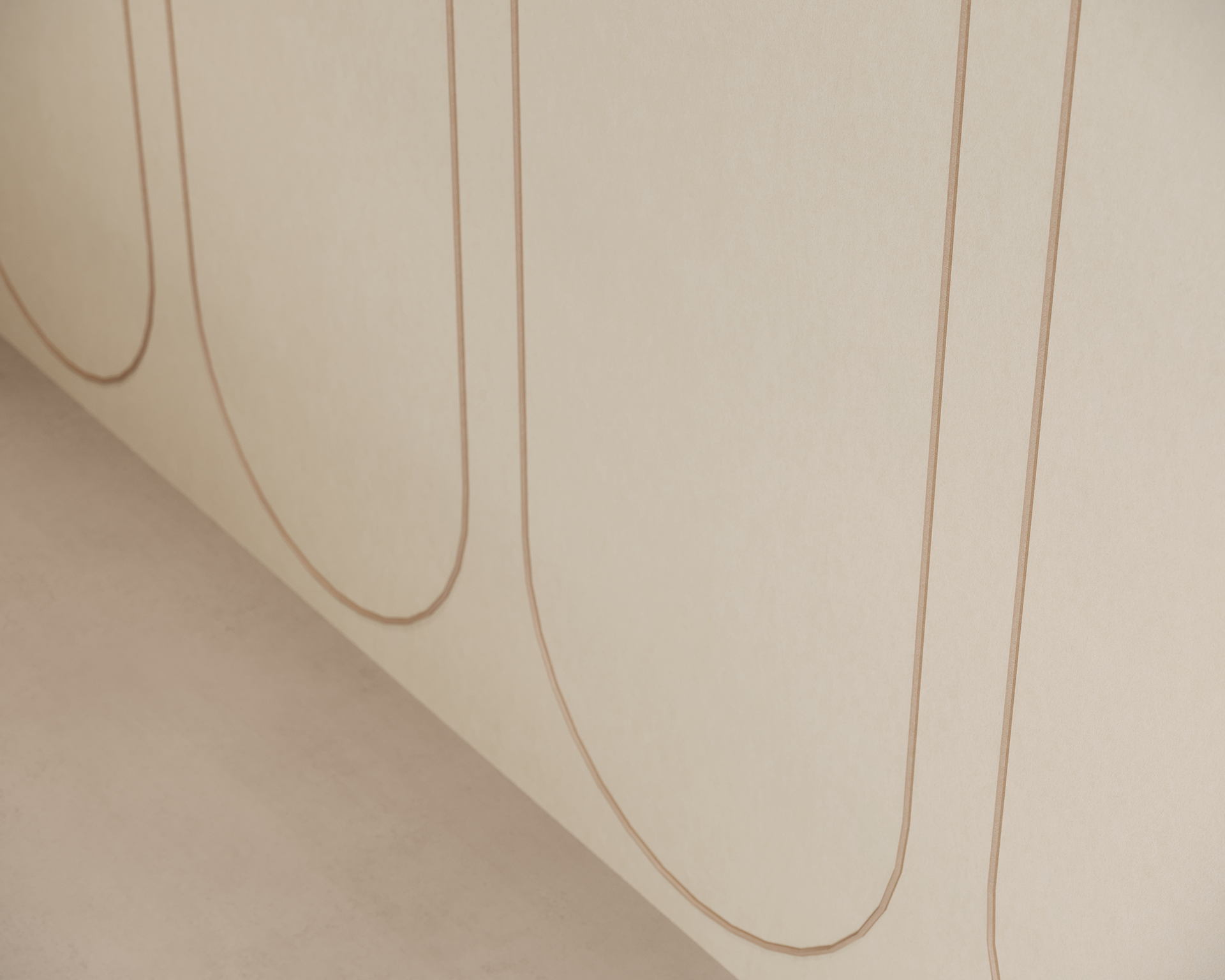 Close-up of a textured acoustic felt beige wall featuring simple, elongated, curved brown lines in a repeating pattern. The design is minimalist and elegant, adding subtle sophistication to the interior.