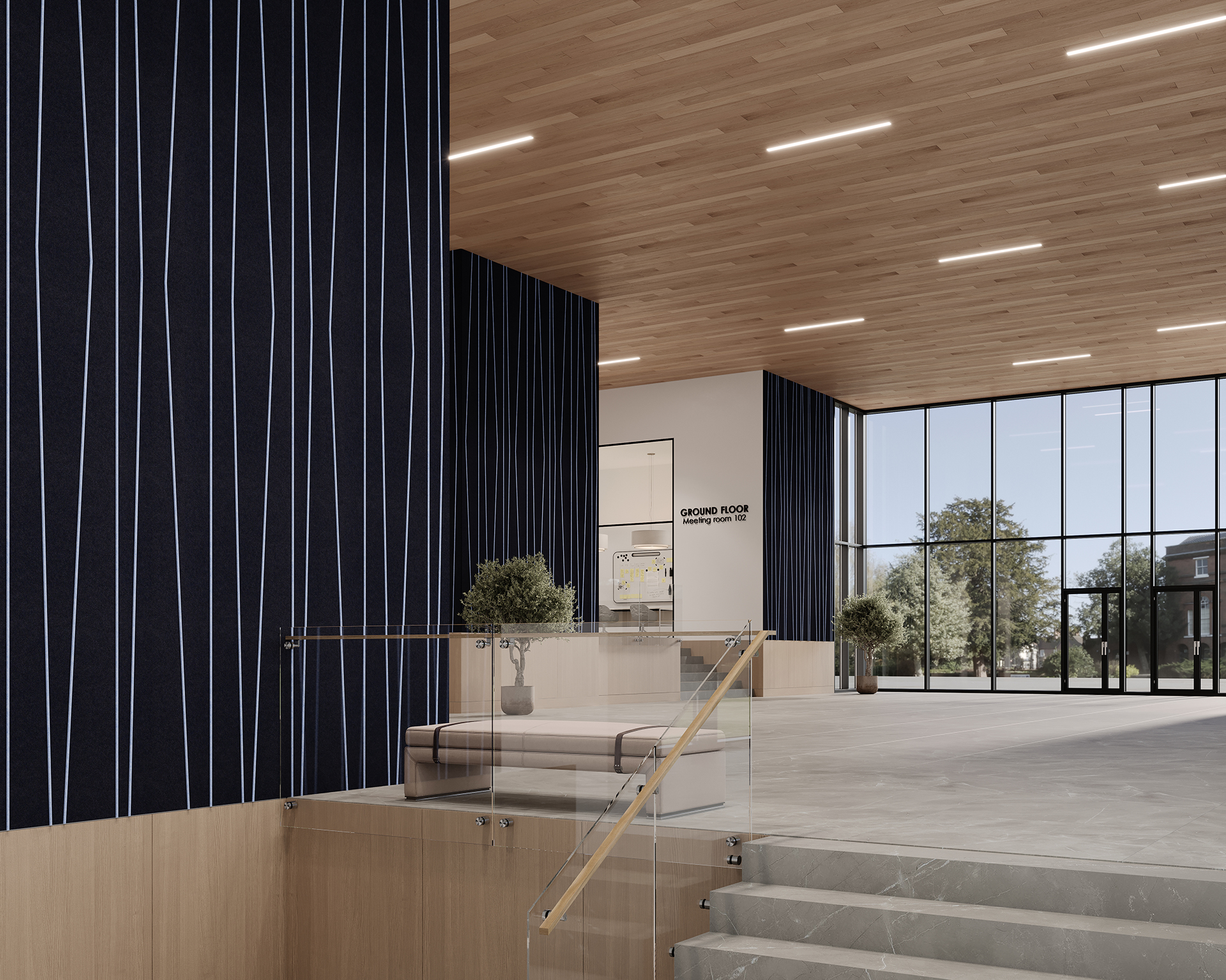 Spacious modern lobby with wooden ceiling and blue vertical striped acoustic felt walls. Large floor-to-ceiling windows showcase trees outside. Glass railing staircase descends to ground with potted plants in the corner. Sign reads "GROUND FLOOR MAIN HALL.