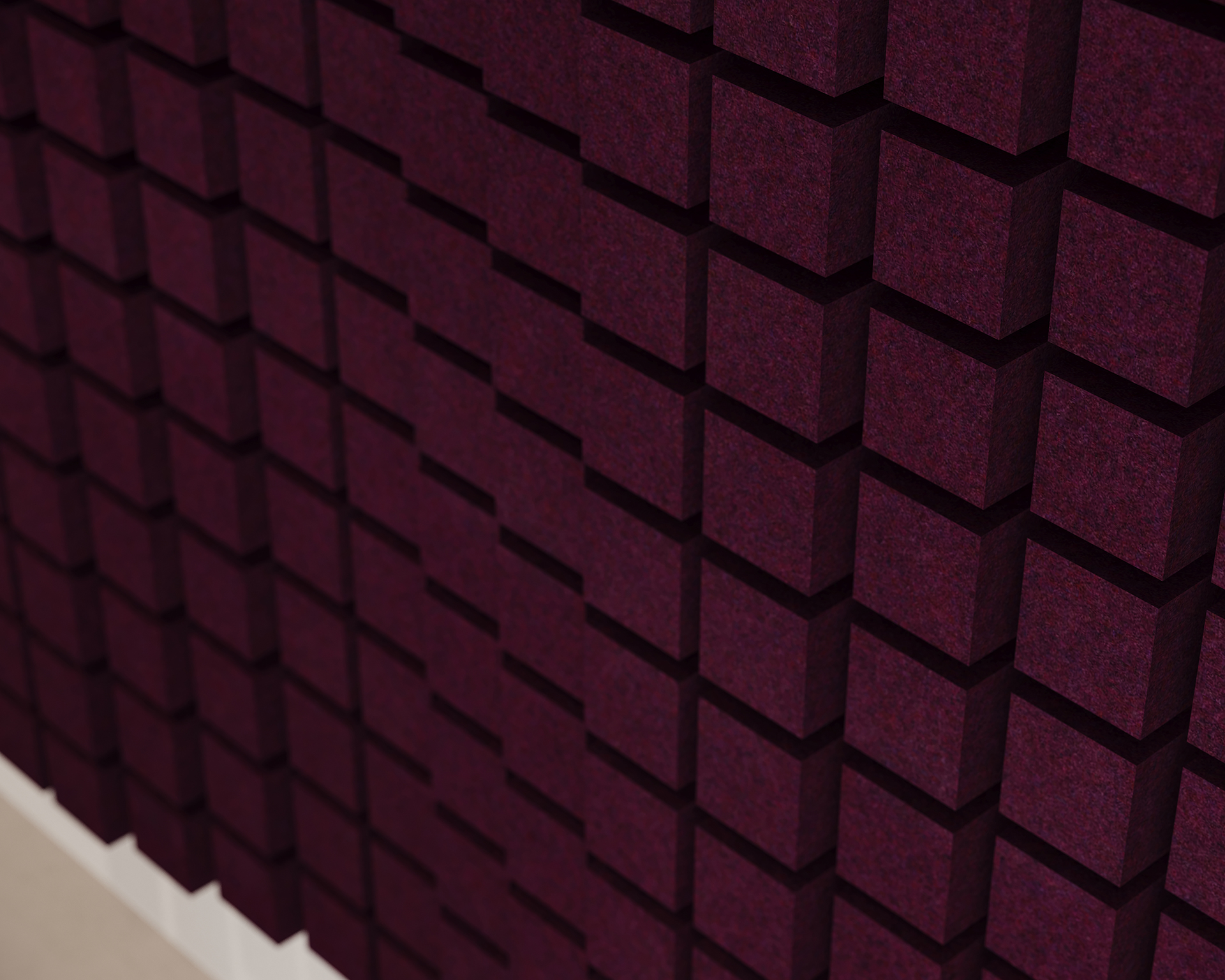 Close-up of a wall covered with dark maroon acoustic felt panels arranged in a grid pattern. The panels are three-dimensional, creating a textured, geometric effect with shadows highlighting the depth.