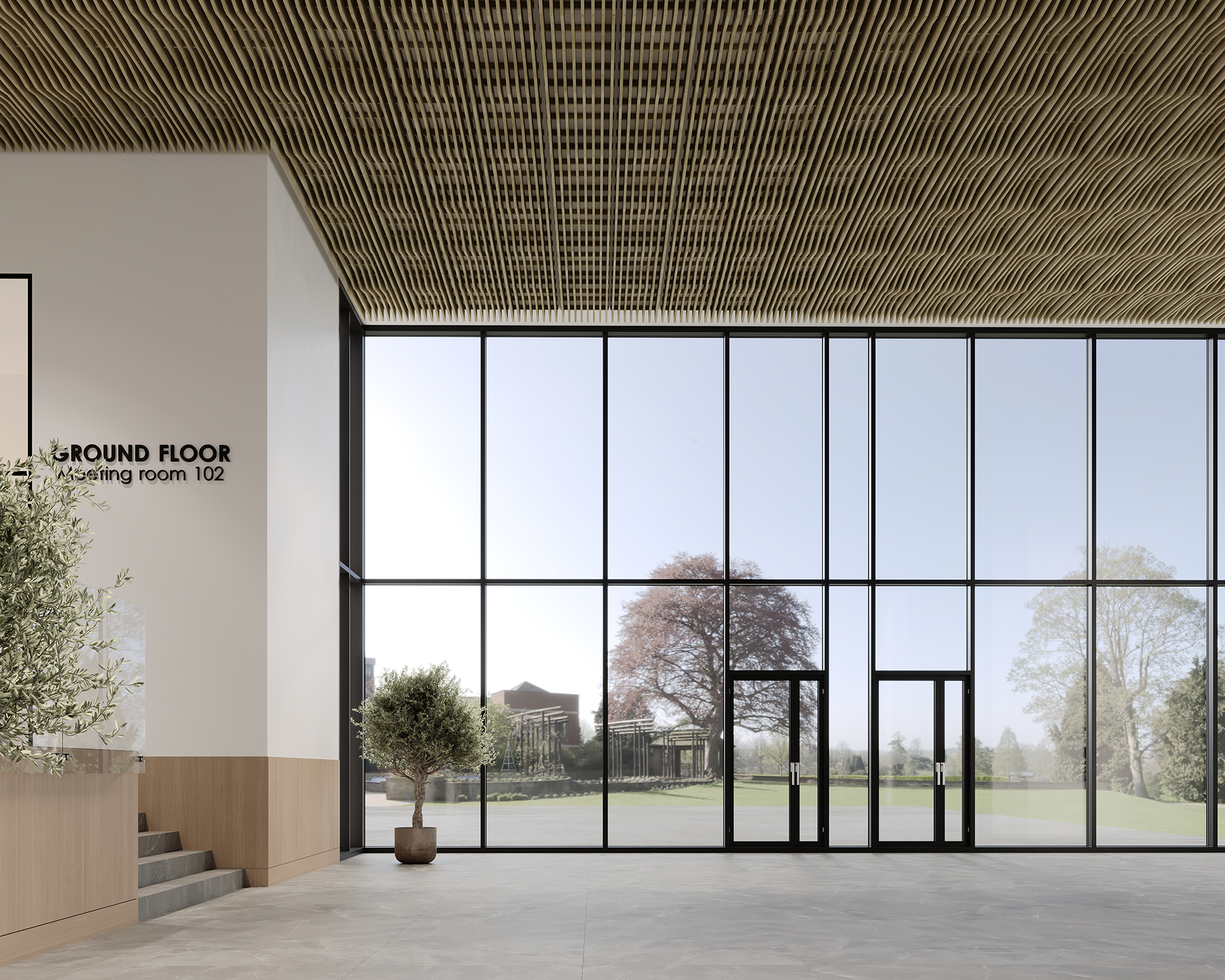 A modern building interior with a high acoustic felt ceiling and large floor-to-ceiling windows overlooking a scenic outdoor view. There is a potted tree inside. A sign reads "Ground Floor, Meeting Room 102" on the wall.