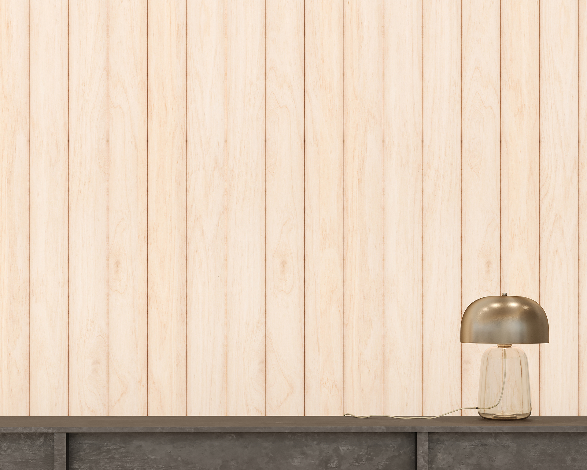 A minimalist scene with a light woodgrain acoustic felt paneled wall, a gray concrete surface, and a modern lamp. The lamp has a smooth, round metallic shade and a clear glass base, and is plugged in with its cord coiled on the surface.
