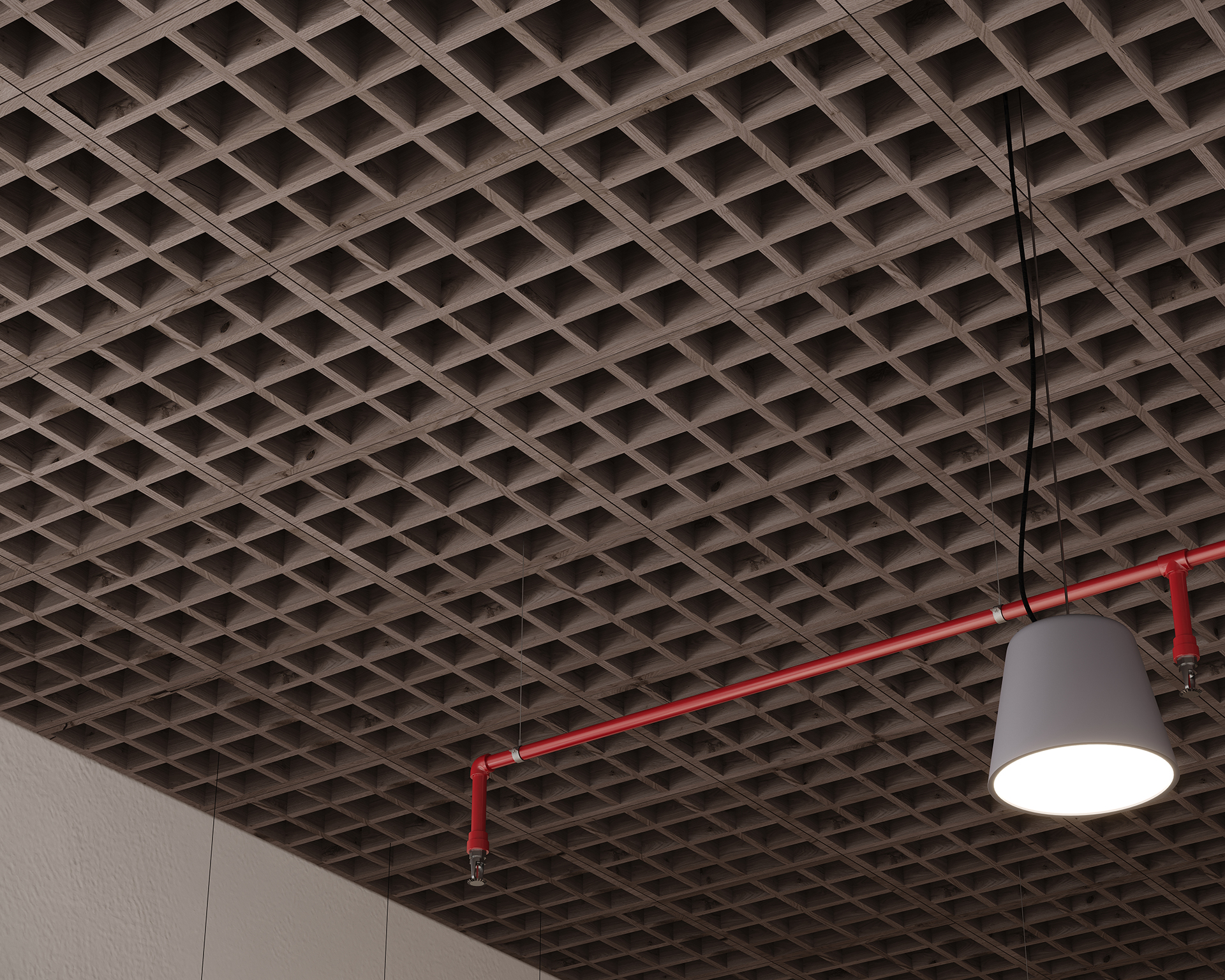 An acoustic felt ceiling with a dark grid pattern, featuring visible square openings. A red pipe runs along the ceiling, and a white pendant light hangs down, casting light downward. The overall setting appears to be industrial or modern.