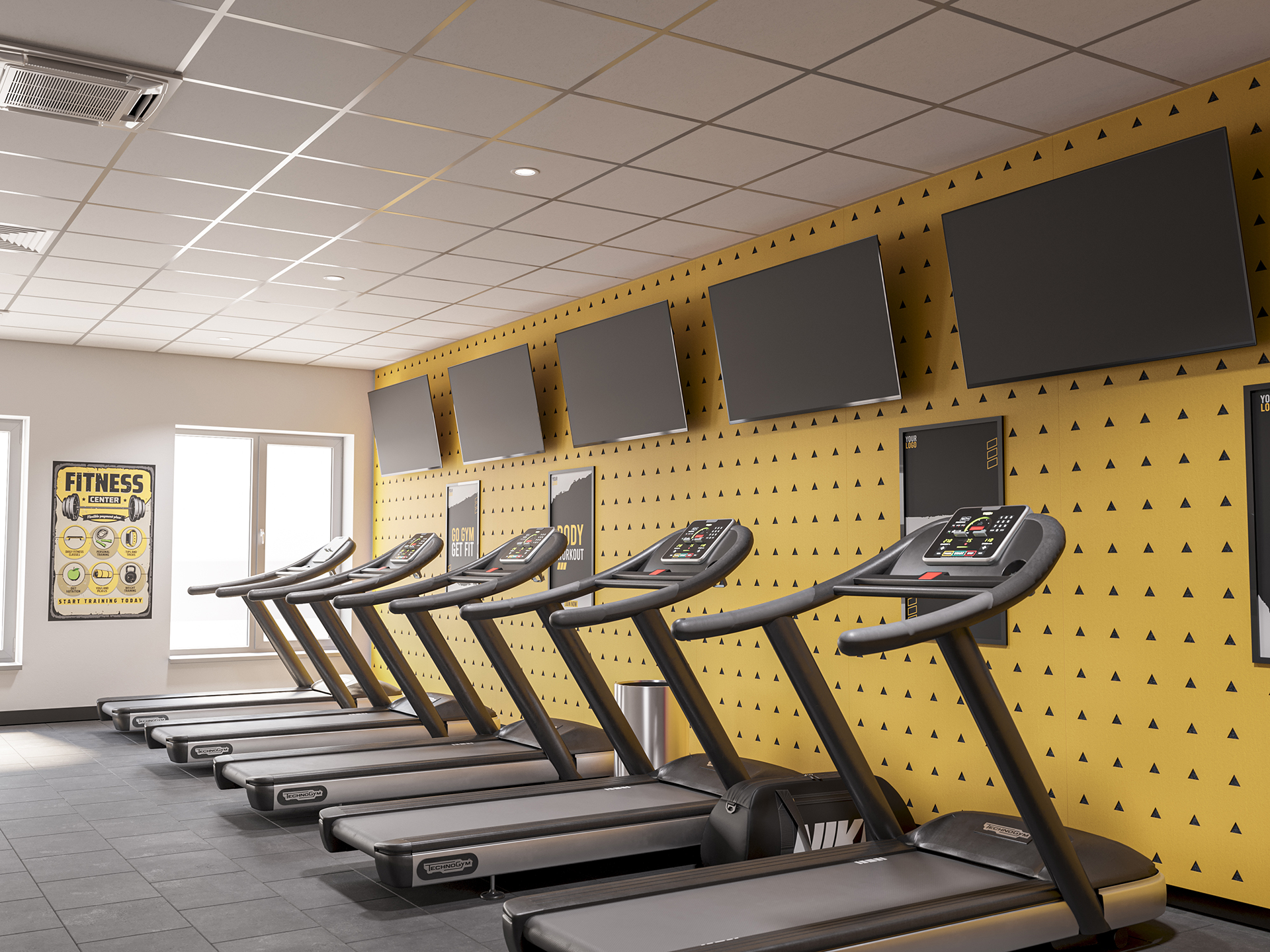 A row of treadmills lines a modern gym with yellow patterned acoustic felt walls, large wall-mounted TVs above, and a fitness information poster near a bright window.